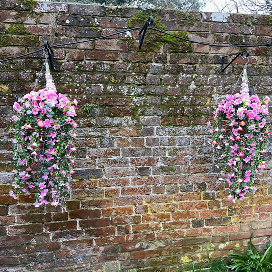 Small pink pair hanging baskets.