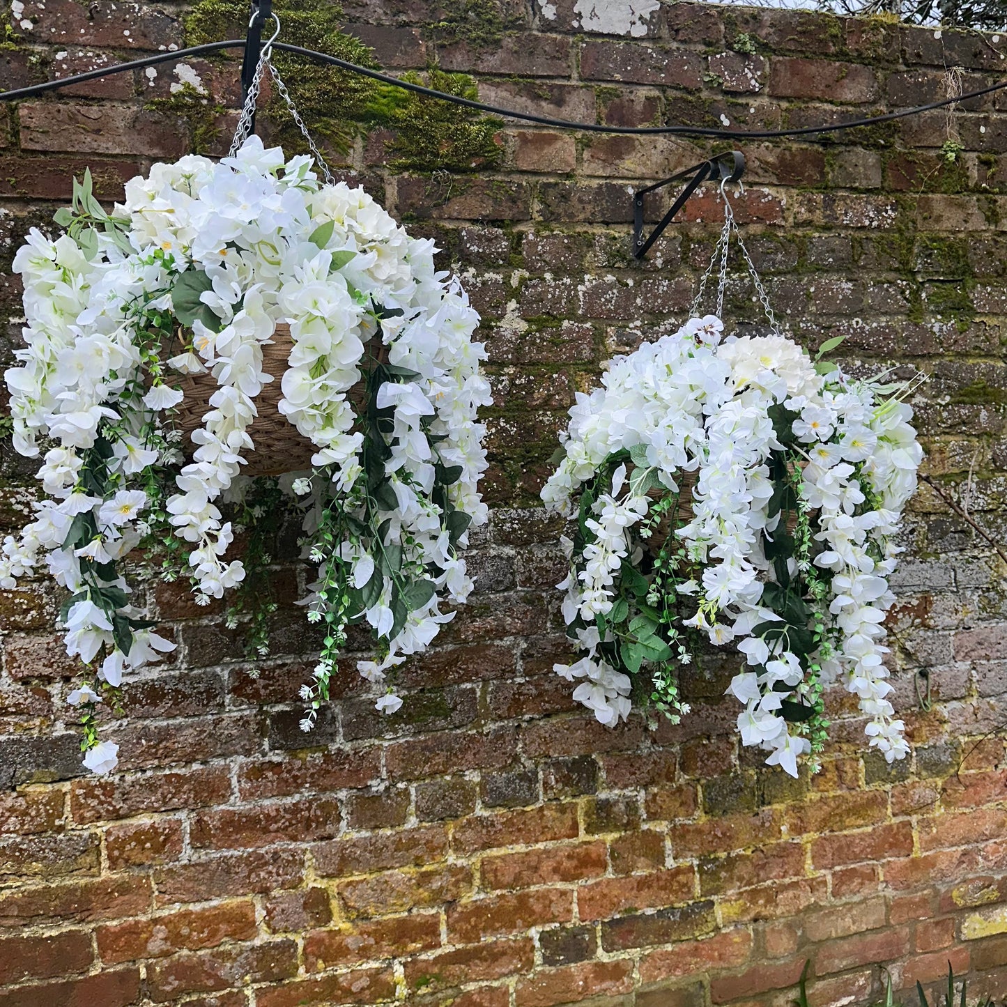Deluxe white florals pair of hanging baskets