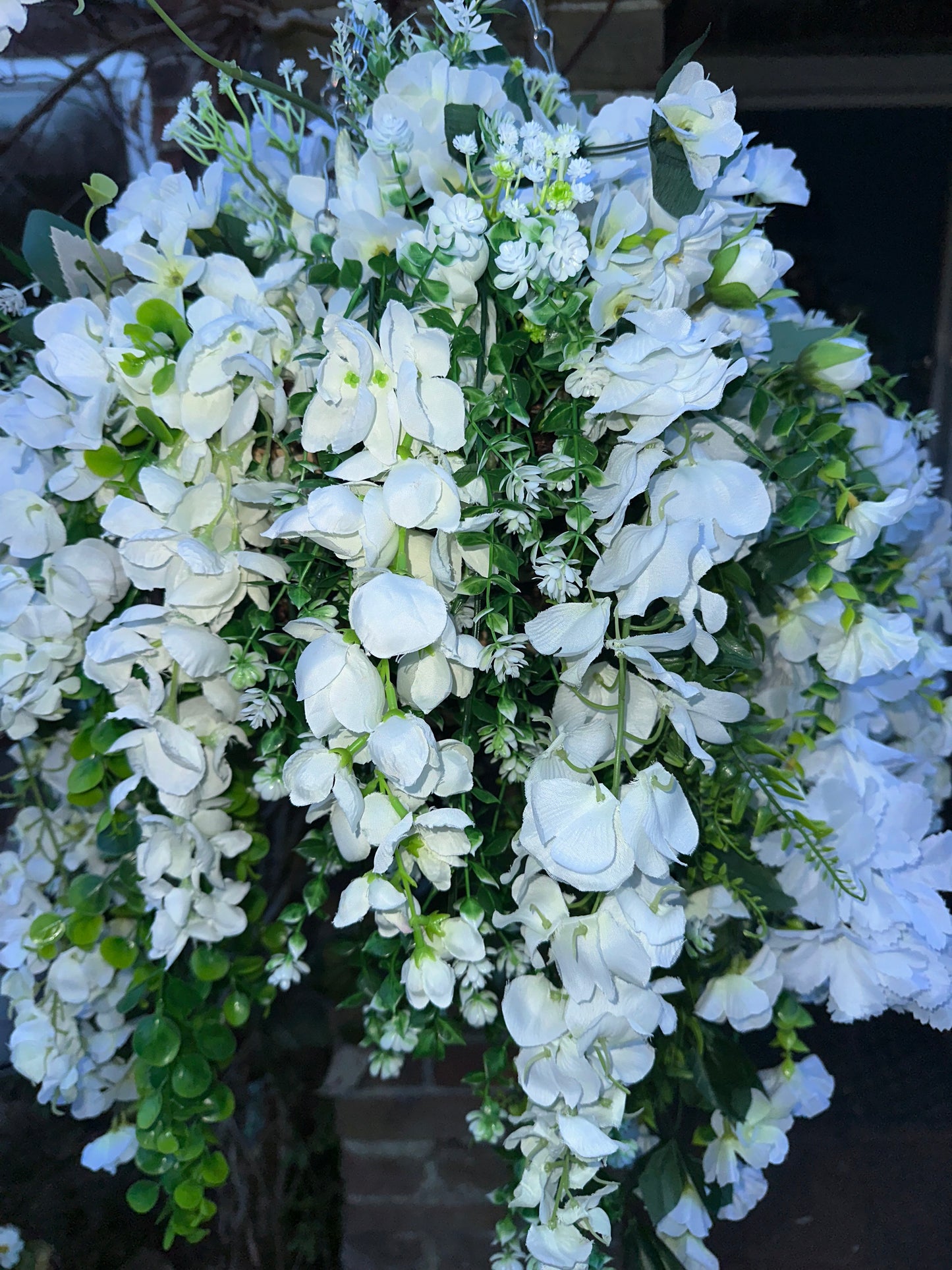 White faux flowers/ foliage full cone hanging baskets.