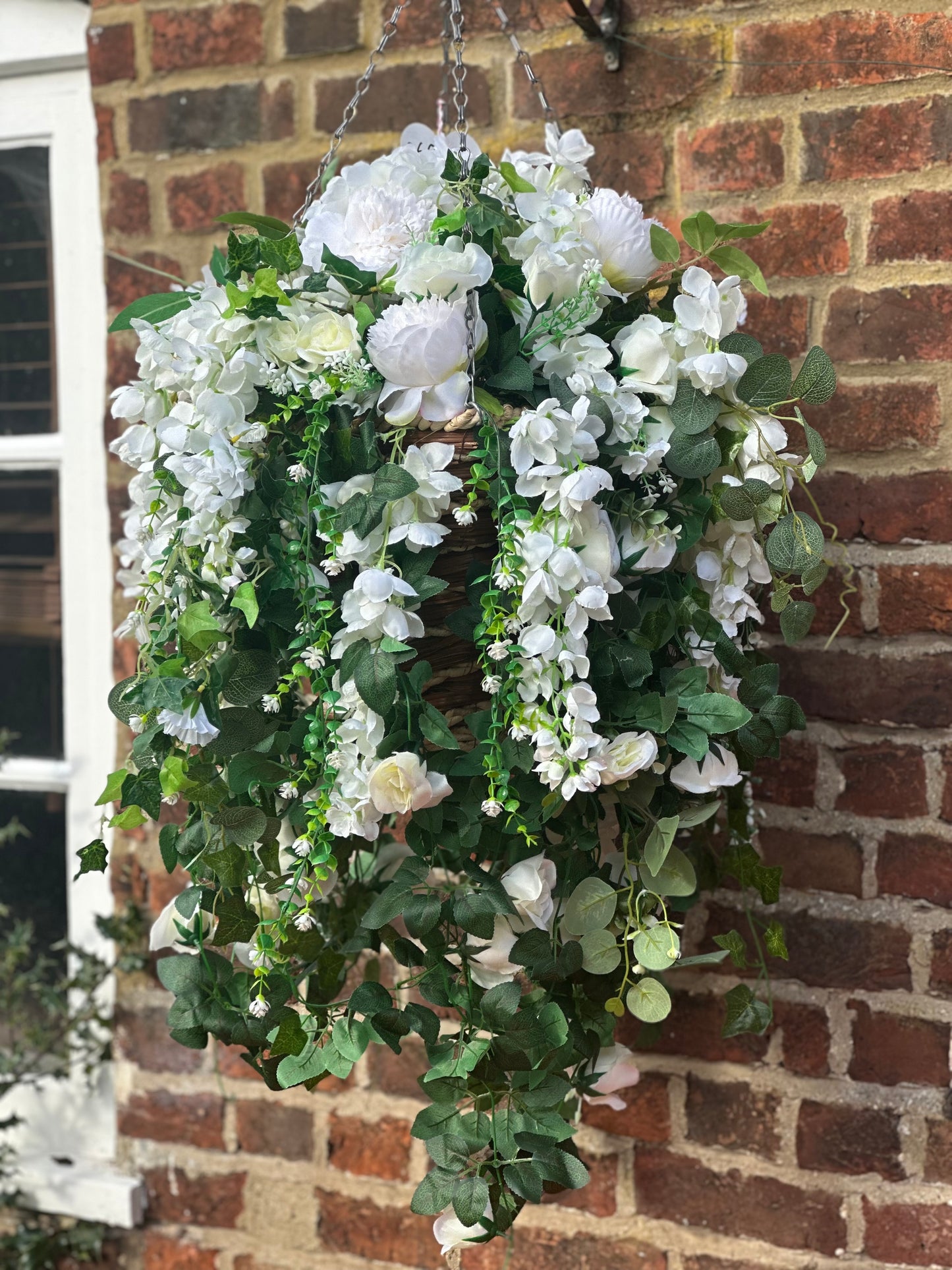 White faux flowers/ foliage full cone hanging baskets.