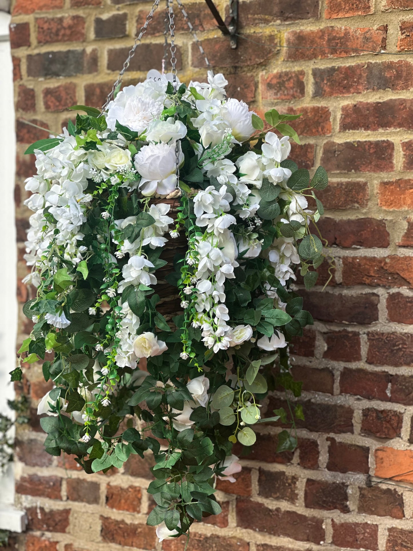 White faux flowers/ foliage full cone hanging baskets.